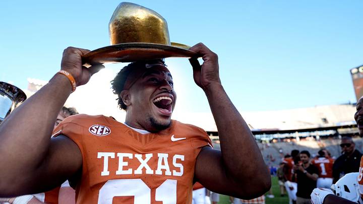 Texas Longhorns tight end Nick Townsend celebrates with the golden hat in the second half of the Red River Rivalry college football game Texas Longhorns tight end Nick Townsend celebrates with the golden hat in the second half of the Red River Rivalry college football game