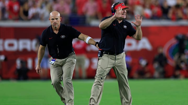 Georgia Bulldogs head coach Kirby Smart is held back by another personnel during the fourth quarter of an NCAA college football matchup Saturday, Nov. 2, 2024 at EverBank Stadium in Jacksonville, Fla. The Georgia Bulldogs defeated the Florida Gators 34-20. [Corey Perrine/Florida Times-Union]