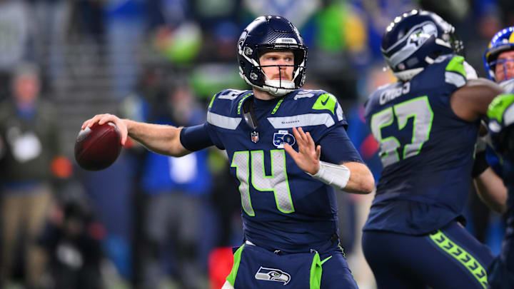 Jan 25, 2026; Seattle, WA, USA; Seattle Seahawks quarterback Sam Darnold (14) passes against the Los Angeles Rams during the second half in the 2026 NFC Championship Game at Lumen Field. Mandatory Credit: Steven Bisig-Imagn Images