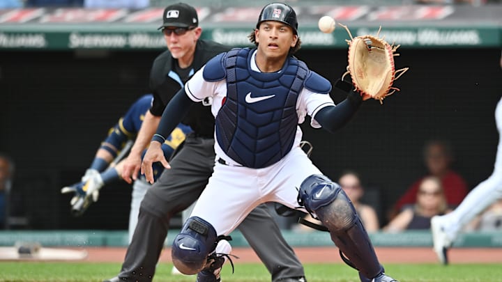 Jun 25, 2023; Cleveland, Ohio, USA; Cleveland Guardians catcher Bo Naylor (23) catches a throw from left fielder Steven Kwan (not pictured) but its too late to tag Milwaukee Brewers second baseman Andruw Monasterio (not pictured) during the fourth inning at Progressive Field. Mandatory Credit: Ken Blaze-Imagn Images