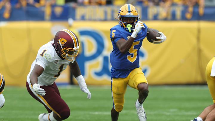 Sep 6, 2025; Pittsburgh, Pennsylvania, USA; Pittsburgh Panthers wide receiver Raphael Williams Jr. (5) runs after catch against Central Michigan Chippewas linebacker Dakota Cochran (1) during the first quarter at Acrisure Stadium. Mandatory Credit: Charles LeClaire-Imagn Images Sep 6, 2025; Pittsburgh, Pennsylvania, USA; Pittsburgh Panthers wide receiver Raphael Williams Jr. (5) runs after catch against Central Michigan Chippewas linebacker Dakota Cochran (1) during the first quarter at Acrisure Stadium. Mandatory Credit: Charles LeClaire-Imagn Images