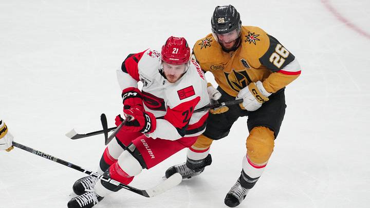 Jun 9, 2026; Las Vegas, Nevada, USA; Carolina Hurricanes defenseman Alexander Nikishin (21) and Vegas Golden Knights center Nic Dowd (26) battle for the puck during the 2nd period in game four of the 2026 Stanley Cup Final at T-Mobile Arena. Mandatory Credit: Stephen R. Sylvanie-Imagn Images Jun 9, 2026; Las Vegas, Nevada, USA; Carolina Hurricanes defenseman Alexander Nikishin (21) and Vegas Golden Knights center Nic Dowd (26) battle for the puck during the 2nd period in game four of the 2026 Stanley Cup Final at T-Mobile Arena. Mandatory Credit: Stephen R. Sylvanie-Imagn Images