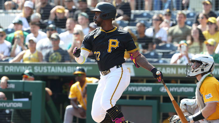 Sep 21, 2025; Pittsburgh, Pennsylvania, USA;  Pittsburgh Pirates designated hitter Andrew McCutchen (22) hits an RBI single against the Athletics during the first inning at PNC Park. Mandatory Credit: Charles LeClaire-Imagn Images