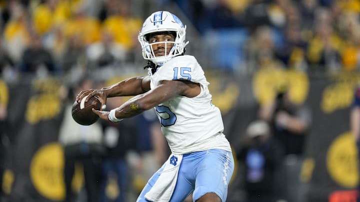 Dec 27, 2023; Charlotte, NC, USA; North Carolina Tar Heels quarterback Conner Harrell (15) throws the ball during the second half against the West Virginia Mountaineers at Bank of America Stadium. Mandatory Credit: Jim Dedmon-USA TODAY Sports