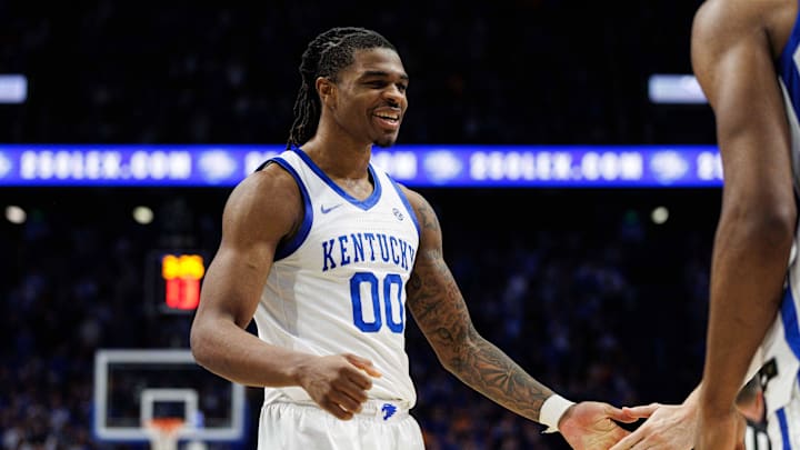 Feb 11, 2025; Lexington, Kentucky, USA; Kentucky Wildcats guard Otega Oweh (00) fives a teammate during the second half against the Tennessee Volunteers at Rupp Arena at Central Bank Center. Mandatory Credit: Jordan Prather-Imagn Images