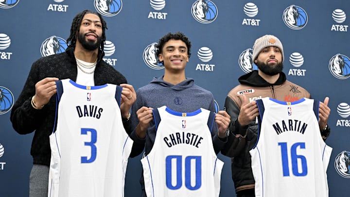 Feb 7, 2025; Dallas, TX, USA; Dallas Mavericks forward Anthony Davis (3) and guard Max Christie (00) and forward Caleb Martin (16) pose for a photo with their new Mavs jerseys during a press conference at the Dallas Mavericks practice facility. Mandatory Credit: Jerome Miron-Imagn Images