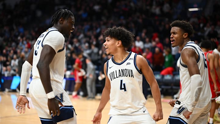 Feb 12, 2025; Villanova, Pennsylvania, USA; Villanova Wildcats guard Tyler Perkins (4) celebrates with forward Enoch Boakye (13) and guard Jordan Longino (15) after the game against St. John's basketball at William B. Finneran Pavilion. 