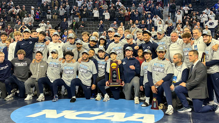 The Penn State wrestling team celebrates winning the team title at the 2025 NCAA Wrestling Championships.