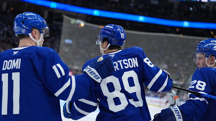Apr 13, 2026; Toronto, Ontario, CAN; Toronto Maple Leafs left wing Nicholas Robertson (89) scores a goal and celebrates with center Max Domi (11) against the Dallas Stars during the third period at Scotiabank Arena. Mandatory Credit: Nick Turchiaro-Imagn Images