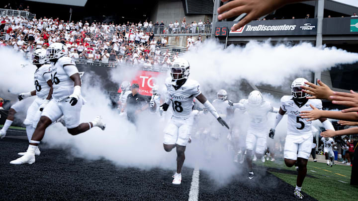 Cincinnati Bearcats safety Marqavious Saboor (18) runs onto the field before the College Football game between the Cincinnati Bearcats and the Towson Tigers at Nippert Stadium in Cincinnati on Saturday, Aug. 31, 2024.