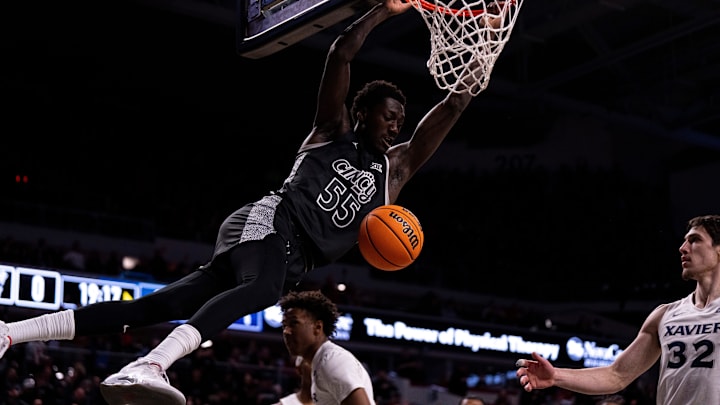 Cincinnati Bearcats forward Aziz Bandaogo (55) dunks in the first half of the NCAA Basketball game between the Cincinnati Bearcats and the Xavier Musketeers at Fifth Third Arena in Cincinnati on Saturday, Dec. 14, 2024. Cincinnati Bearcats forward Aziz Bandaogo (55) dunks in the first half of the NCAA Basketball game between the Cincinnati Bearcats and the Xavier Musketeers at Fifth Third Arena in Cincinnati on Saturday, Dec. 14, 2024.