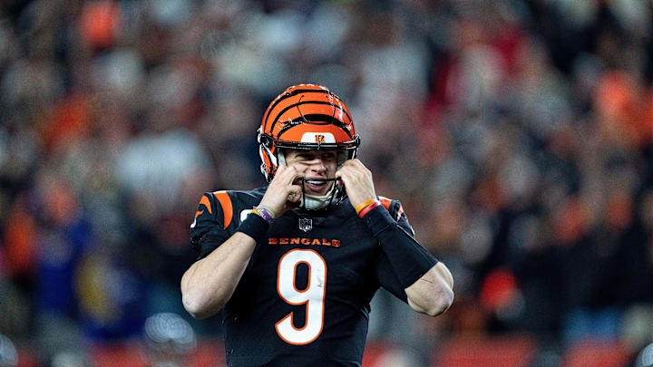 Cincinnati Bengals quarterback Joe Burrow (9) adjust his helmet after scoring a touchdown on a quarterback sneak in the third quarter during an NFL wild-card playoff football game between the Baltimore Ravens and the Cincinnati Bengals, Sunday, Jan. 15, 2023, at Paycor Stadium in Cincinnati.

Baltimore Ravens At Cincinnati Bengals Afc Wild Card Jan 15 202