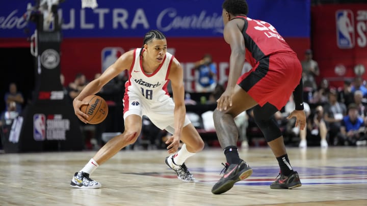 Jul 12, 2024; Las Vegas, NV, USA; Washington Wizards forward Kyshawn George (18) controls the ball against Atlanta Hawks forward E.J. Liddell (32) during the second half at Thomas & Mack Center. Mandatory Credit: Lucas Peltier-USA TODAY Sports Jul 12, 2024; Las Vegas, NV, USA; Washington Wizards forward Kyshawn George (18) controls the ball against Atlanta Hawks forward E.J. Liddell (32) during the second half at Thomas & Mack Center. Mandatory Credit: Lucas Peltier-USA TODAY Sports