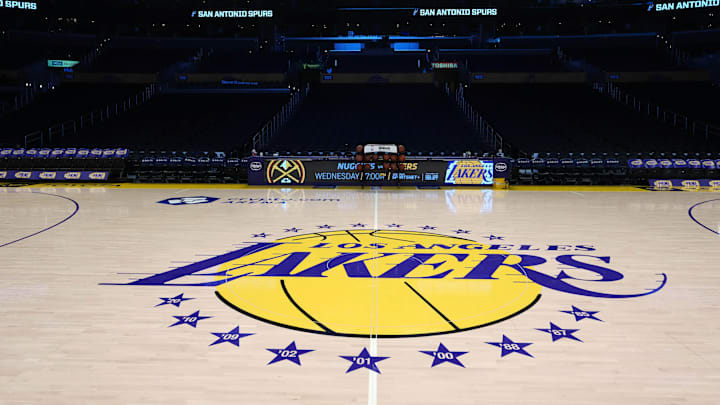 Mar 17, 2025; Los Angeles, California, USA; The Los Angeles Lakers logo at midcourt at Crypto.com Arena. Mandatory Credit: Kirby Lee-Imagn Images