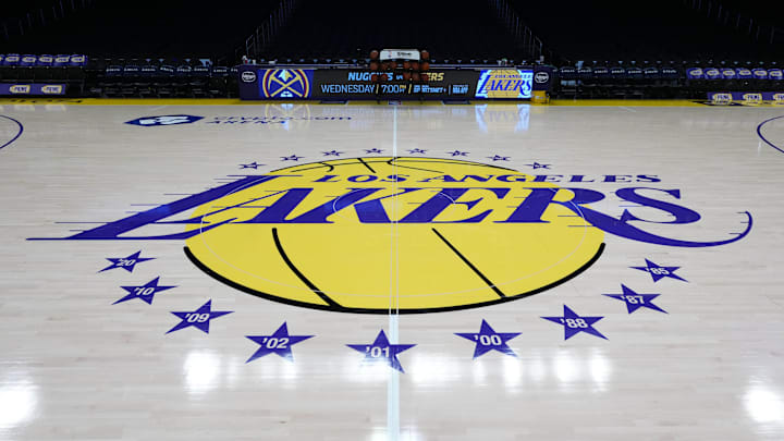 Mar 17, 2025; Los Angeles, California, USA; The Los Angeles Lakers logo at midcourt at Crypto.com Arena. Mandatory Credit: Kirby Lee-Imagn Images