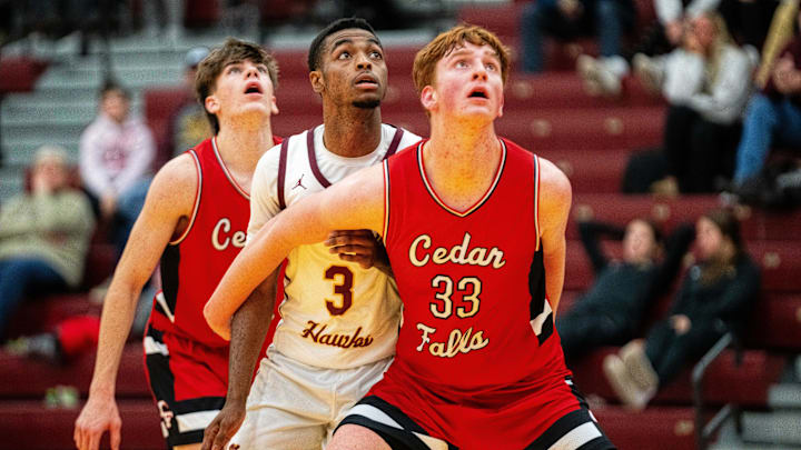 Ankeny's LaMarious Clark (3) and Cedar Falls' Leyton Wolf (33) look for the rebound after an Ankeny free throw on Thursday, Dec. 19, 2024, at Ankeny High School. Ankeny's LaMarious Clark (3) and Cedar Falls' Leyton Wolf (33) look for the rebound after an Ankeny free throw on Thursday, Dec. 19, 2024, at Ankeny High School.