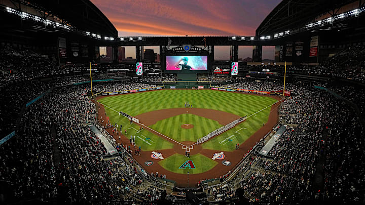 The sun sets as Diamondbacks players are introduced during Opening Day 2024 at Chase Field.