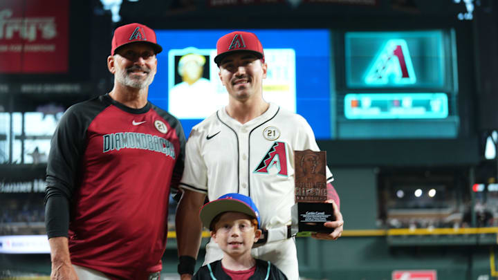 Sep 15, 2025; Phoenix, Arizona, USA; Arizona Diamondbacks outfielder Corbin Carroll is recognized as a finals for the Roberto Clemente Award before the game against the San Francisco Giants as he stands alongside manager Torey Lovullo at Chase Field. Mandatory Credit: Joe Camporeale-Imagn Images