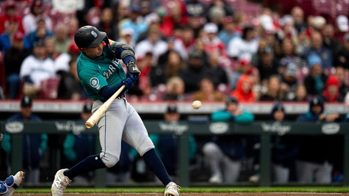 Seattle Mariners third baseman Ben Williamson hits a single during a game against the Cincinnati Reds on April 15 at Great American Ballpark.
