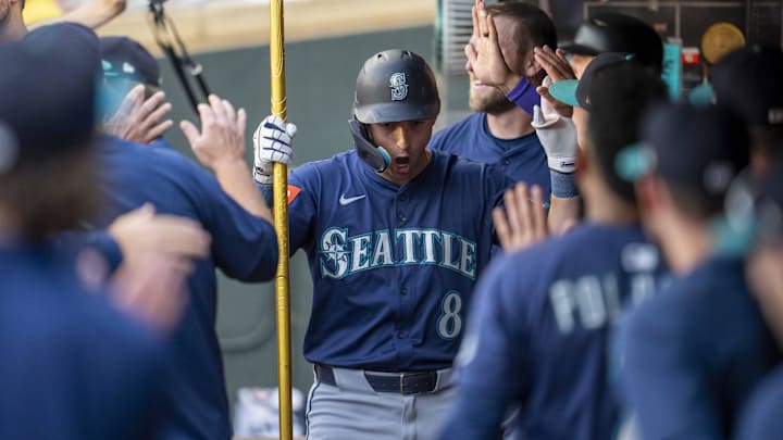 Seattle Mariners right fielder Dominic Canzone (8) celebrates after hitting a home run against the Minnesota Twins on June 23 at Target Field. Seattle Mariners right fielder Dominic Canzone (8) celebrates after hitting a home run against the Minnesota Twins on June 23 at Target Field.