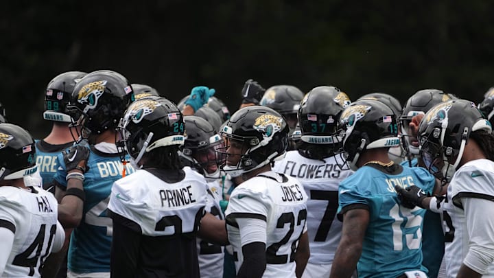 Oct 16, 2024; Watford, United Kingdom; Jacksonville Jaguars players huddle during practice at The Grove. Mandatory Credit: Kirby Lee-Imagn Images
