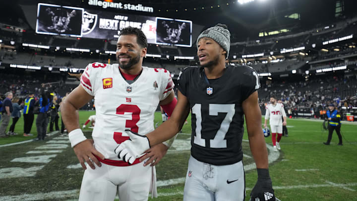 New York Giants quarterback Russell Wilson (3) and Las Vegas Raiders wide receiver Tyler Lockett (17) pose for a photo after the game at Allegiant Stadium.