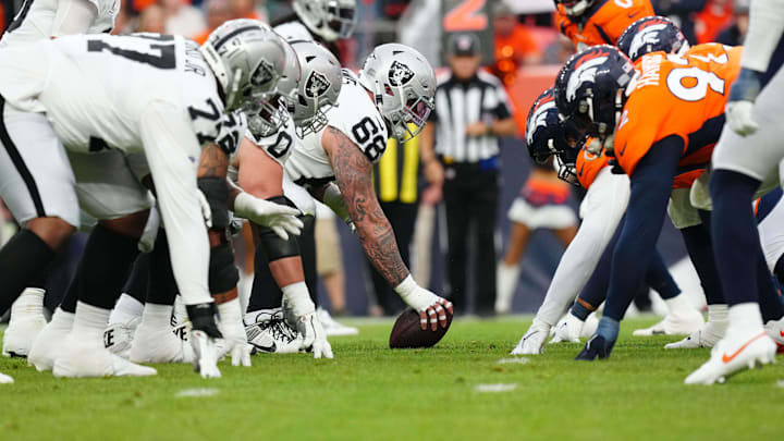 Sep 10, 2023; Denver, Colorado, USA; Members of the Las Vegas Raiders and the Denver Broncos line up in third quarter at Empower Field at Mile High. Mandatory Credit: Ron Chenoy-Imagn Images Sep 10, 2023; Denver, Colorado, USA; Members of the Las Vegas Raiders and the Denver Broncos line up in third quarter at Empower Field at Mile High. Mandatory Credit: Ron Chenoy-Imagn Images