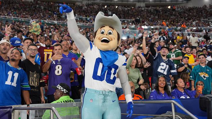 Dallas Cowboys mascot Rowdy poses with fans during the game against the Baltimore Ravens at Maracana Stadium. Dallas Cowboys mascot Rowdy poses with fans during the game against the Baltimore Ravens at Maracana Stadium.