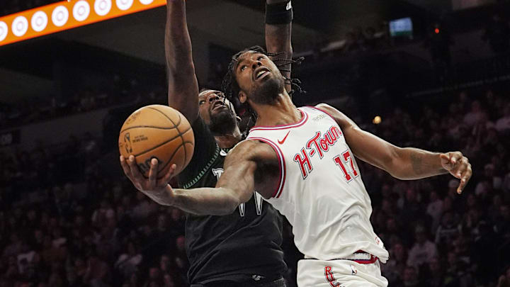 Mar 25, 2026; Minneapolis, Minnesota, USA; Houston Rockets forward Tari Eason (17) goes to the basket against Minnesota Timberwolves center Naz Reid (11) in the third quarter at Target Center. Mandatory Credit: Bruce Kluckhohn-Imagn Images