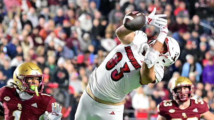 Oct 25, 2024; Chestnut Hill, Massachusetts, USA; Louisville Cardinals tight end Mark Redman (83) tries to make a catch during the first half against the Boston College Eagles at Alumni Stadium. Mandatory Credit: Eric Canha-Imagn Images Oct 25, 2024; Chestnut Hill, Massachusetts, USA; Louisville Cardinals tight end Mark Redman (83) tries to make a catch during the first half against the Boston College Eagles at Alumni Stadium. Mandatory Credit: Eric Canha-Imagn Images