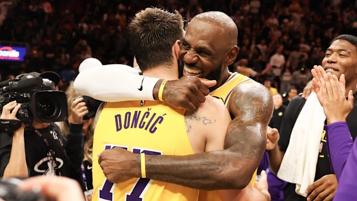 Mar 19, 2026; Miami, Florida, USA; Los Angeles Lakers forward LeBron James (23) celebrates with guard Luka Doncic (77) after 60 point game against the Miami Heat at Kaseya Center. Mandatory Credit: Isabella Frias-Imagn Images