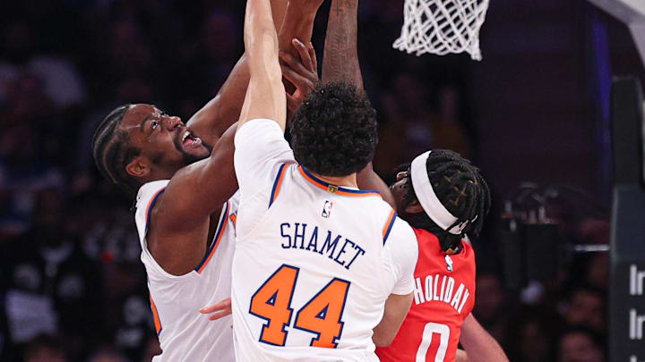Feb 3, 2025; New York, New York, USA; New York Knicks center Ariel Hukporti (55) and guard Landry Shamet (44) rebounds against Houston Rockets guard Aaron Holiday (0) during the first half at Madison Square Garden. Mandatory Credit: Vincent Carchietta-Imagn Images