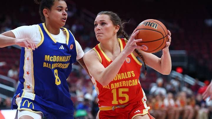 Mar 31, 2026; Glendale, AZ, USA; Kate Harpring (15) moves the ball against Lizzy Spaight (8) during the McDonalds All American Girls Game at Desert Diamond Arena. Mandatory Credit: Mark J. Rebilas-Imagn Images