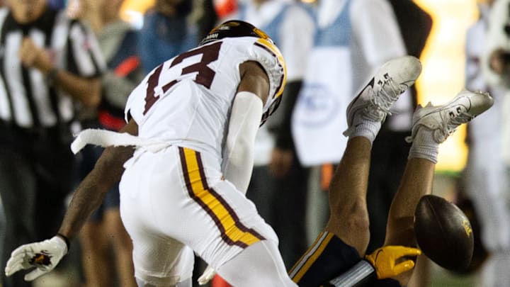 Sep 13, 2025; Berkeley, California, USA; California Golden Bears wide receiver Mark Hamper (15) cannot hold onto a pass in front of Minnesota Golden Gophers defensive back Mike Gerald (13) during the first quarter at California Memorial Stadium. Mandatory Credit: D. Ross Cameron-Imagn Images