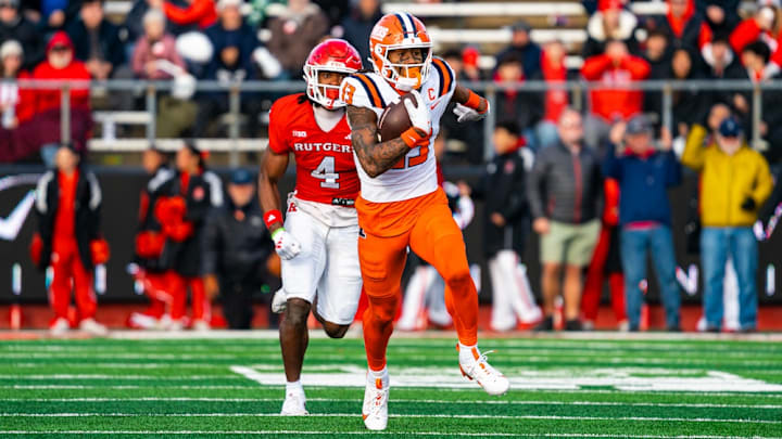 Illinois wide receiver Pat Bryant (13) outruns a Rutgers defender on his way to the game-winning score in the Illini's 38-31 win at SHI Stadium in Piscataway, New Jersey, on Nov. 23.