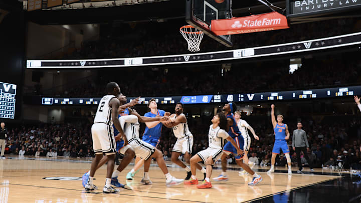 Full play action of Vanderbilt basketball players boxing out to rebound the ball.