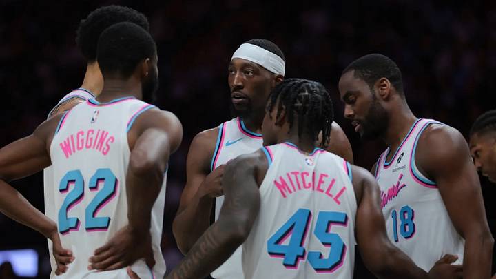 Mar 25, 2025; Miami, Florida, USA; Miami Heat center Bam Adebayo (13) talks to center Kel'el Ware (7), forward Andrew Wiggins (22), guard Davion Mitchell (45), and guard Alec Burks (18) during the second quarter against the Golden State Warriors at Kaseya Center. Mar 25, 2025; Miami, Florida, USA; Miami Heat center Bam Adebayo (13) talks to center Kel'el Ware (7), forward Andrew Wiggins (22), guard Davion Mitchell (45), and guard Alec Burks (18) during the second quarter against the Golden State Warriors at Kaseya Center.