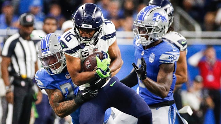 Sep 17, 2023; Detroit, Michigan, USA; Detroit Lions safety Brian Branch (32) tackles Seattle Seahawks wide receiver Tyler Lockett (16) during the second half at Ford Field. Mandatory Credit: Junfu Han-Imagn Images