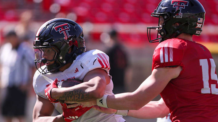 Texas Tech's Quinten Joyner takes the handoff from Will Hammond during spring football practice, Tuesday, April 15, 2025, at Jones AT&T Stadium.