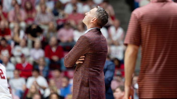 Alabama head coach Nate Oats looks a replay in the second half of the game against Auburn on Mar. 7, 2026.