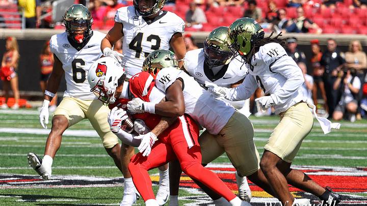 Treyshun Hurry is bottled up by Wake Forest defenders in a 30-27 loss on Saturday.  