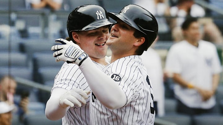 May 22, 2021; Bronx, New York, USA; New York Yankees first baseman Mike Ford (36) is congratulated by New York Yankees designated hitter Luke Voit (59) after hitting a solo home run singles against the Chicago White Sox during the sixth inning at Yankee Stadium. Mandatory Credit: Andy Marlin-Imagn Images