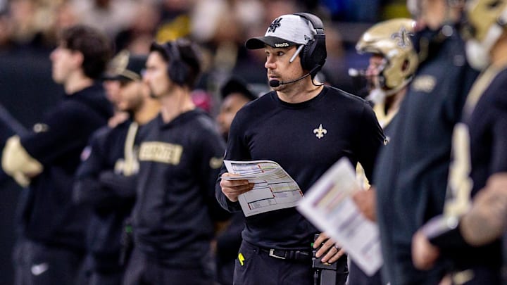Dec 29, 2024; New Orleans, Louisiana, USA;  New Orleans Saints offensive coordinator lint Kubiak looks on against the Las Vegas Raiders during the first half at Caesars Superdome. Mandatory Credit: Stephen Lew-Imagn Images