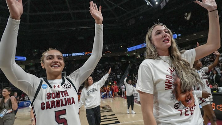 South Carolina guard Tessa Johnson (5) waves near South Carolina forward Chloe Kitts (21), wearing a T-shirt “Who Can Guard Tessa?” Monday, March 23, 2026, after the game at the NCAA Women's Basketball Tournament at Colonial Life Arena in Columbia, South Carolina.