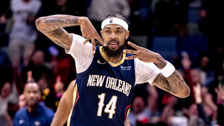 Dec 5, 2024; New Orleans, Louisiana, USA;  New Orleans Pelicans forward Brandon Ingram (14) reacts to making a three point basket against the Phoenix Suns during the first half  at Smoothie King Center. Mandatory Credit: Stephen Lew-Imagn Images
