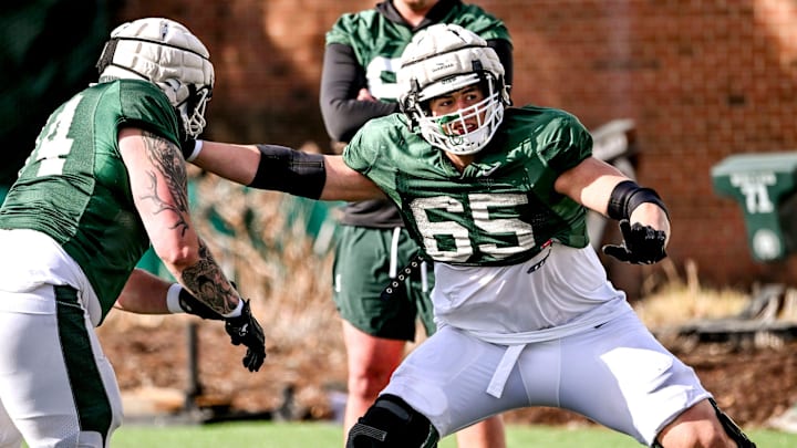 Michigan State offensive lineman Stanton Ramil, right, and Gavin Broscious work out during football practice on Tuesday, April 8, 2025, in East Lansing. Michigan State offensive lineman Stanton Ramil, right, and Gavin Broscious work out during football practice on Tuesday, April 8, 2025, in East Lansing.