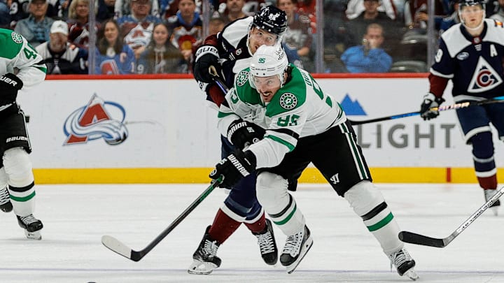 Oct 11, 2025; Denver, Colorado, USA; Dallas Stars center Matt Duchene (95) controls the puck ahead of Colorado Avalanche center Martin Necas (88) in the third period at Ball Arena. Mandatory Credit: Isaiah J. Downing-Imagn Images