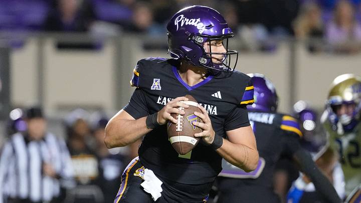 Oct 16, 2025; Greenville, North Carolina, USA; East Carolina Pirates quarterback Katin Houser (4) rolls out of the pocket against the Tulsa Golden Hurricane during the first half at Dowdy-Ficklen Stadium. Mandatory Credit: James Guillory-Imagn Images Oct 16, 2025; Greenville, North Carolina, USA; East Carolina Pirates quarterback Katin Houser (4) rolls out of the pocket against the Tulsa Golden Hurricane during the first half at Dowdy-Ficklen Stadium. Mandatory Credit: James Guillory-Imagn Images