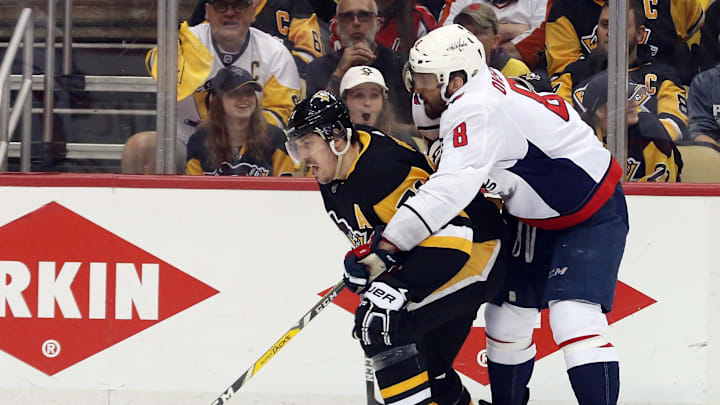 May 7, 2018; Pittsburgh, PA, USA; Pittsburgh Penguins center Evgeni Malkin (71) moves the puck against pressure from Washington Capitals left wing Alex Ovechkin (8) during the second period in game six of the second round of the 2018 Stanley Cup Playoffs at PPG PAINTS Arena. The Capitals won 2-1 in overtime to win the series 4 games to 2. Mandatory Credit: Charles LeClaire-Imagn Images