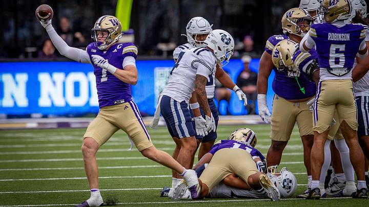 Alex McLaughlin holds up his interception against Utah State. Alex McLaughlin holds up his interception against Utah State.